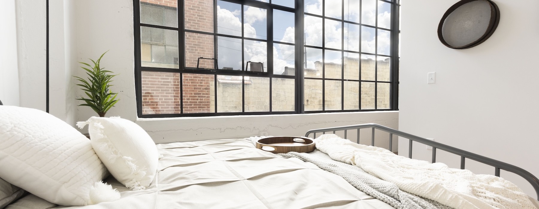 a bed with a white bed spread