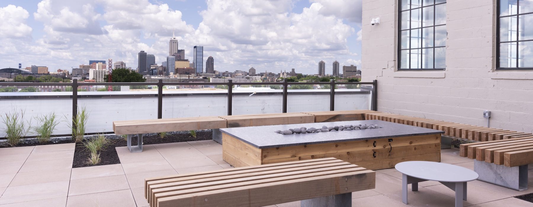 a fire pit with long wooden benches