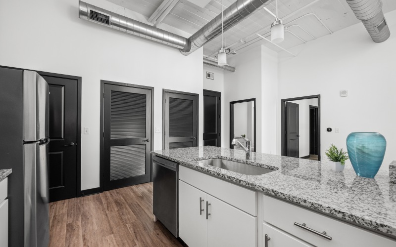 a kitchen with white cabinets