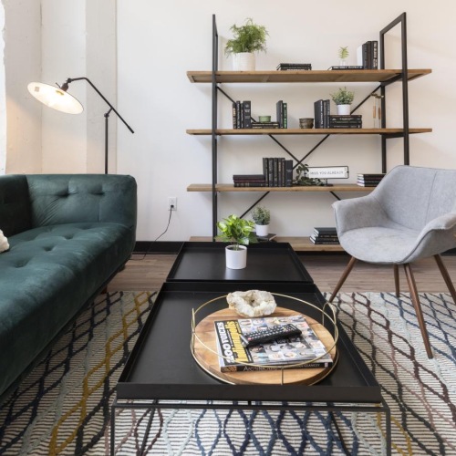 a living room with a coffee table and couches