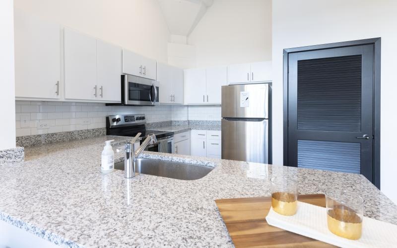 a kitchen with white cabinets